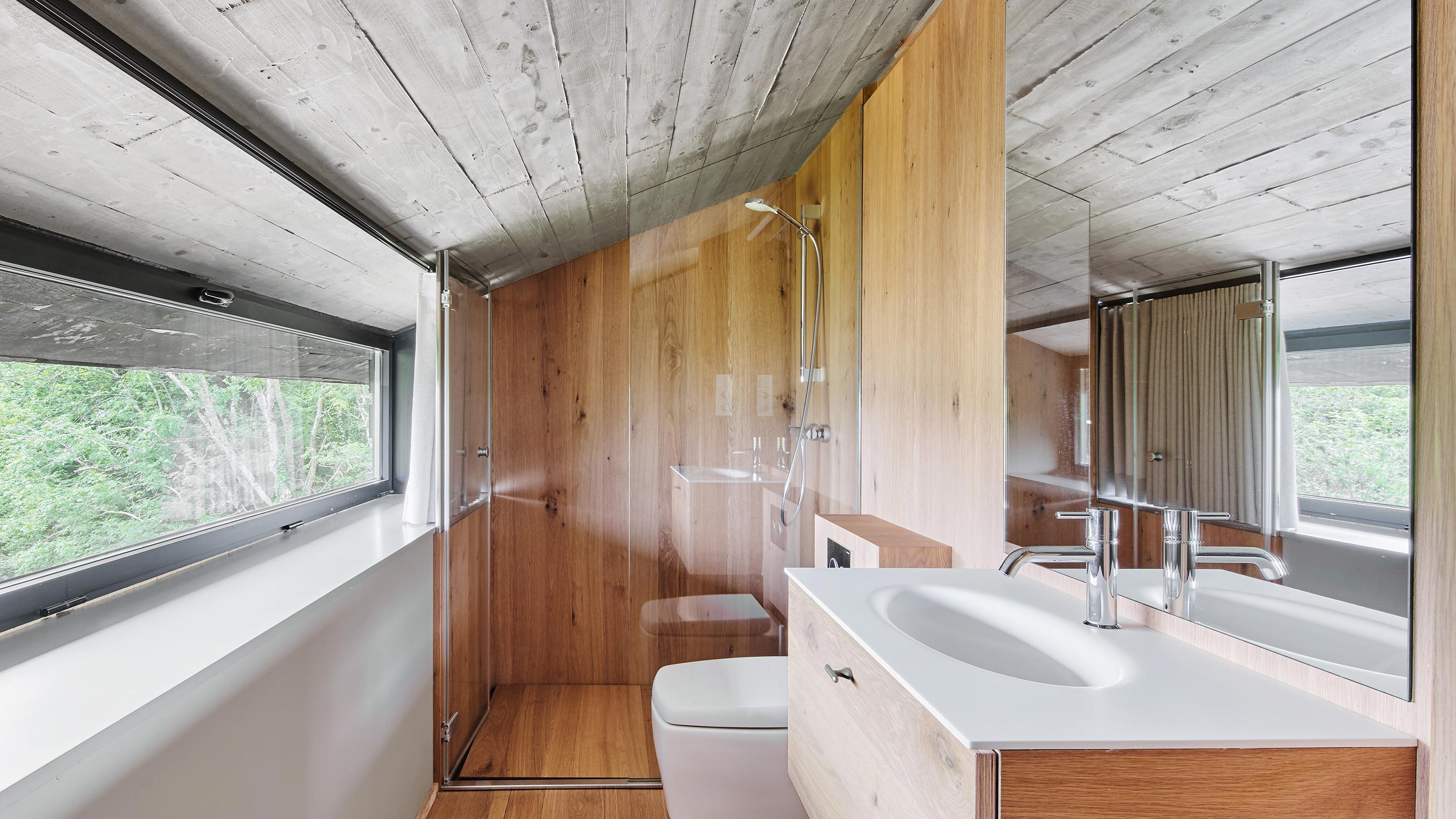 Parklex Prodema waterproof interior timber panelling and flooring for the bathrooms at the Landaburu Borda rural house