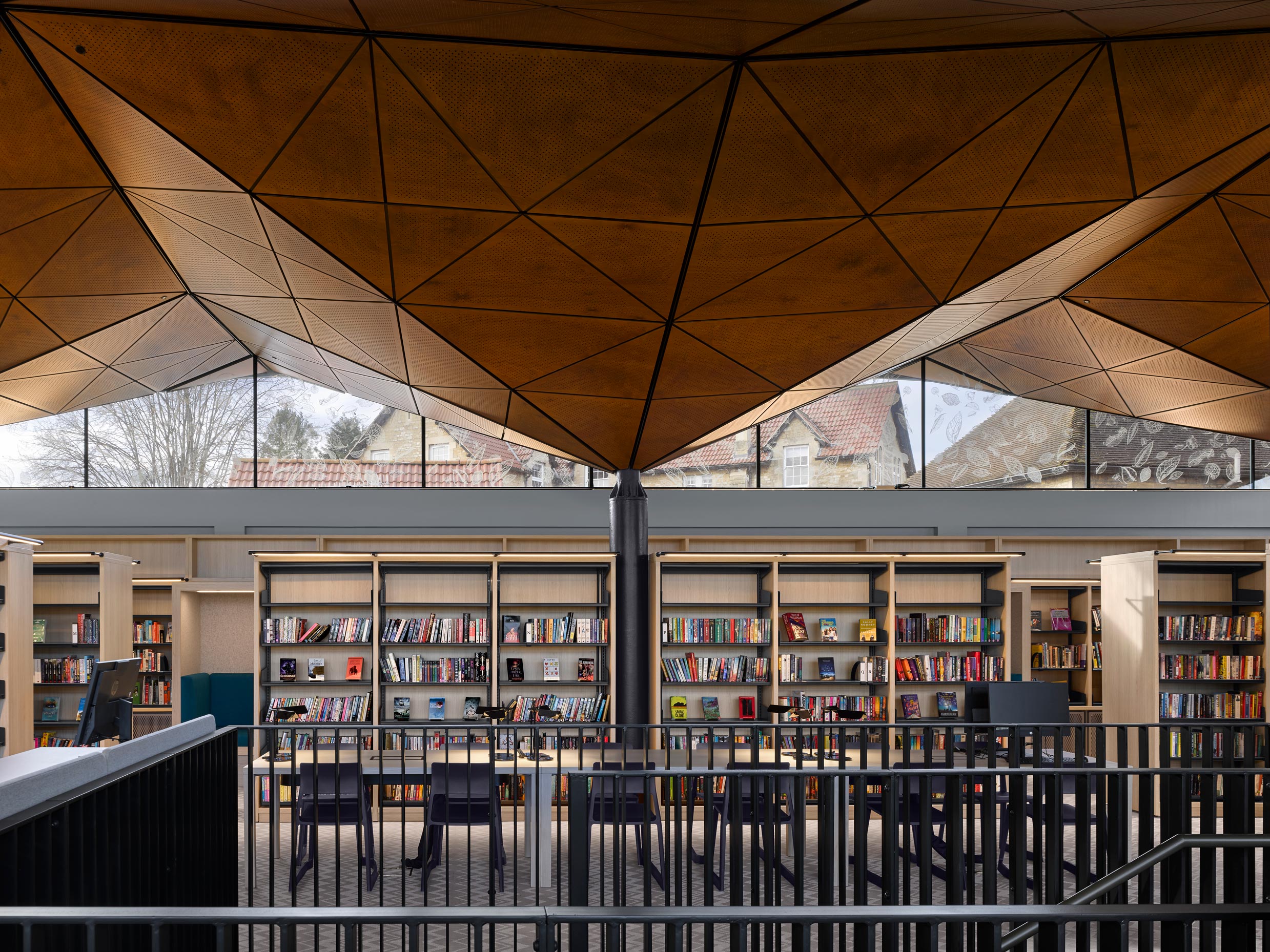 Parklex Prodema custom-cut and installed panels with acoustic perforations for the wooden soffit at St. Mary's Calne School Library