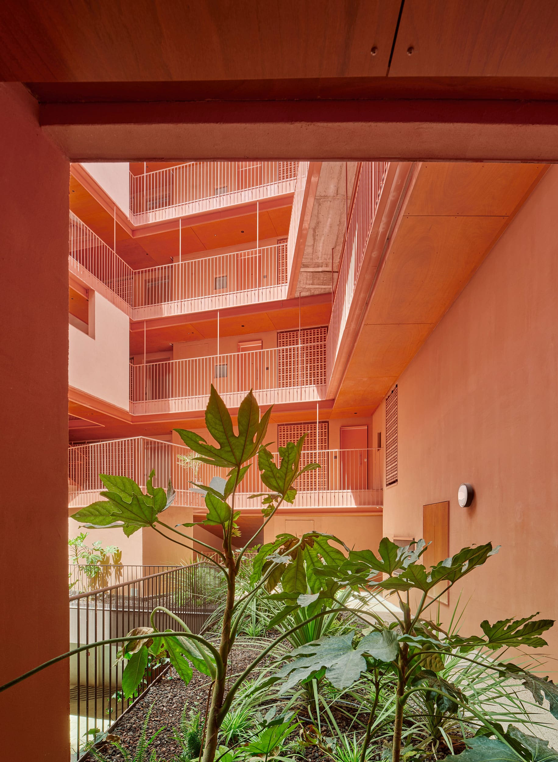 Parklex Prodema natural wood soffit clads the exterior communal areas in the 106-apartment building by MARMOLBRAVO and MADhel Architects.