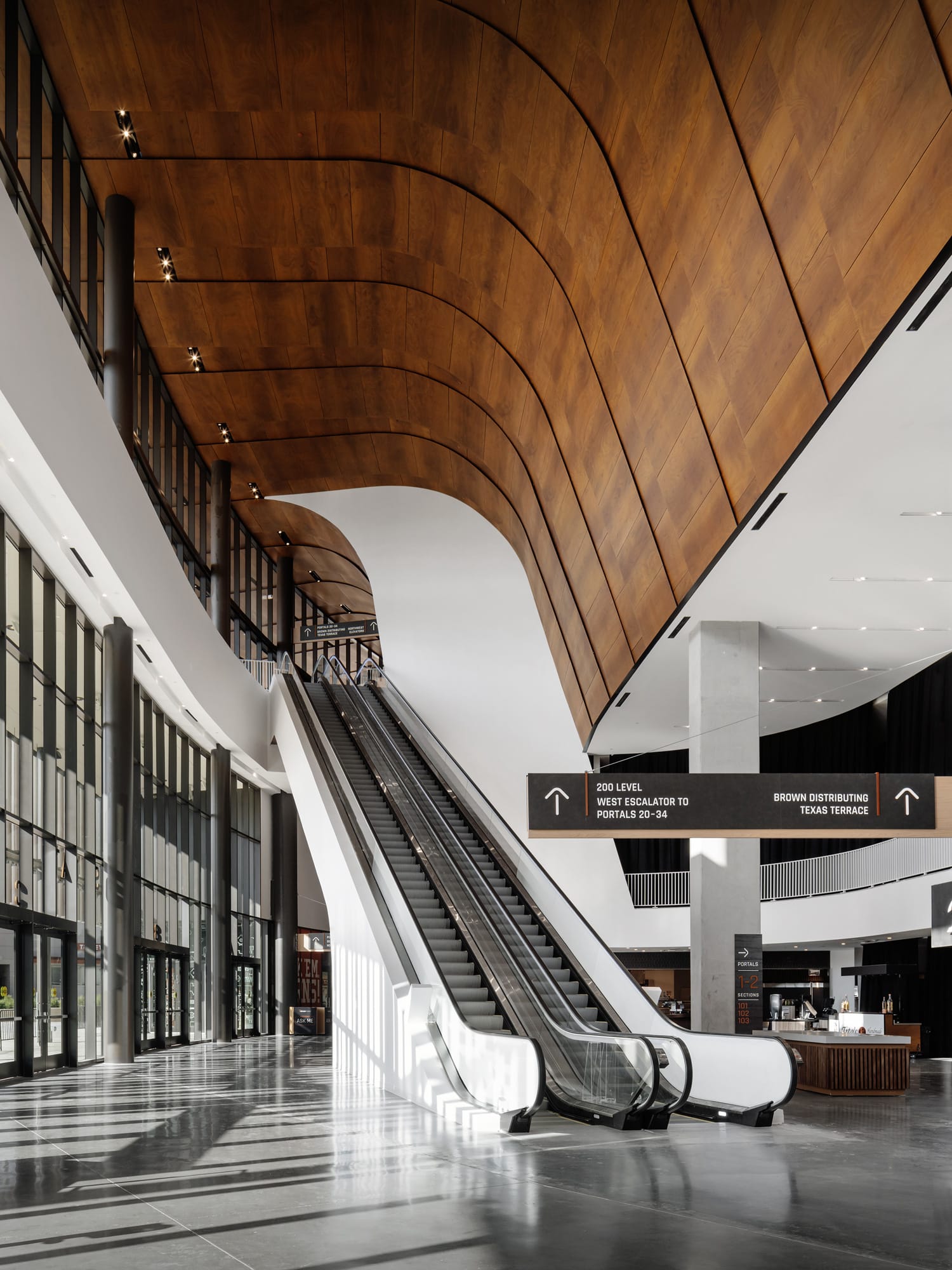Natural wood panelling interior and exterior at Moody Center University of Texas Austin
