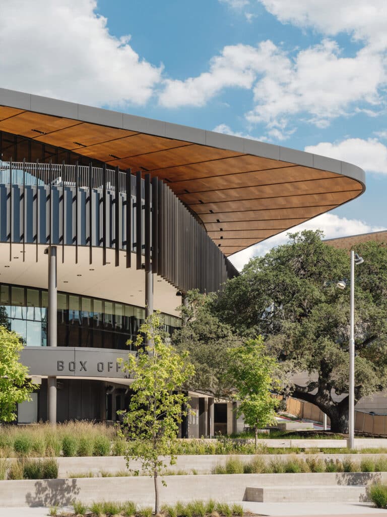 Natural wood panelling interior and exterior at Moody Center University of Texas Austin